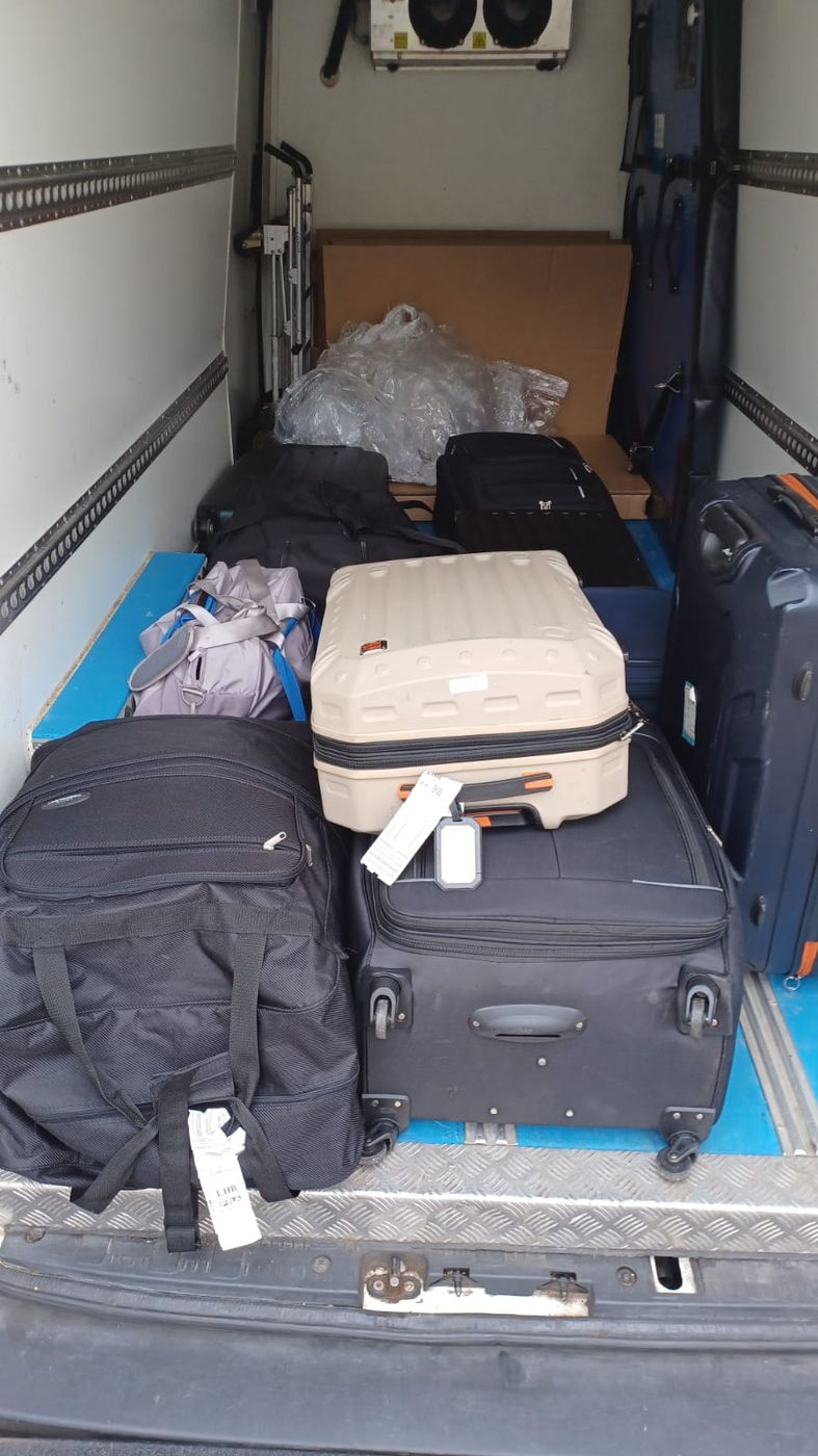 Customer suitcases collected for shipping by Excess Luggage Co.